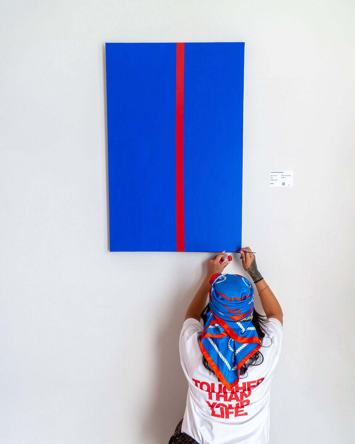 Mixed medium artwork by Fresh Sam hung in a gallery