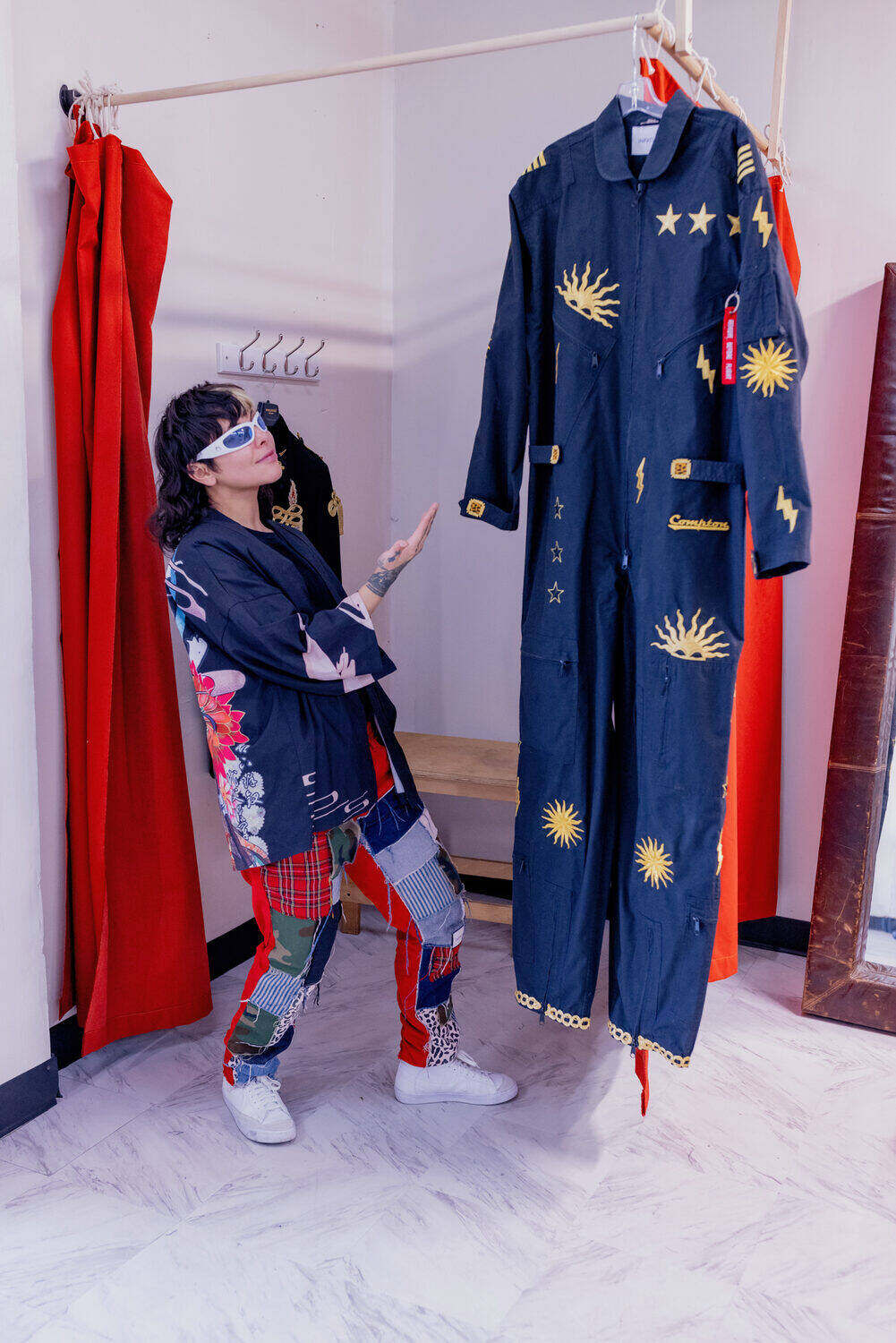 Fresh Sam with custom-designed coats in the atelier